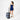 Woman holding a Sherpani Ciel Dolomite Duffle Luggage by roller handle against white backdrop.  #color_dolomite