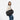 A woman wearing a Sherpani Camden Raven Black Ultimate Backpack with crossbody strap against white background #color_raven-black