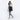 Woman wearing a Sherpani Camden Raven Black Backpack across her shoulder against white background. #color_raven-black