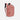 A Sherpani Crew Desert Pink Travel Backpack, 3/4 view showing lockable zippers and the extender pocket against a white background #color_desert-pink