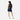 Woman wearing a Sherpani Juno Raven Black Duffel Backpack on her back against white backdrop.   #color_black