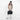 Woman holding a Sherpani Juno Chromatic Black Duffel Backpack by duffle straps against white backdrop. #color_chromatic-black