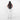 Woman wearing a Sherpani Juno Chromatic Black Duffel Backpack on her back against white backdrop.  #color_chromatic-black
