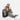 Woman sitting next to a Sherpani Juno Ciao Duffel Backpack against white backdrop. #color_ciao-print