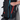 Person unzipping the extending pocket on a Sherpani Juno Chromatic Black Duffel Backpack.