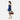 Woman holding a Sherpani Juno Moab Duffel Backpack by duffle straps against white backdrop.   #color_moab
