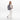 A woman wearing a Sherpani Solstice Passport Anti-Theft Travel Backpack on her back against a white background.   #color_passport-print