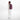 A woman wearing a Sherpani Solstice Smoky Orchid Anti-Theft Travel Backpack on her back against a white background.   #color_smoky-orchid-pink