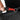 Person locking zipper on a Sherpani Tempest Granite Grey Anti-theft Convertible Tote. 
