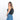 A woman wearing a Sherpani Wayfarer Chromatic Black Convertible Sling on her back against white background.  #color_chromatic-black