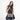 A woman wearing a Sherpani Ceara Dune Expandable Crossbody while sitting against a white background.  #color_dune-tan