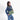 A woman wearing a Sherpani Ceara Olivine Expandable Crossbody on her shoulder against a white background.   #color_olivine-green