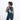 Woman wearing a Sherpani Hyk Surf Blue Hip Pack across her back against white backdrop. #color_surf-blue