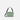 A Sherpani Mei Aloe Mist Green Anti-theft Travel Trio Crossbody, back view showing strap options on white backdrop. #color_aloe-mist-green