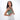 Woman holding a Sherpani Mei Aloe Mist Green Anti-theft Travel Trio Crossbody by short strap against white backdrop.   #color_aloe-mist-green