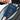 Person placing passport inside a Sherpani Mei Granite Grey Anti-theft Travel Trio Crossbody. 