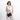 Woman holding a Sherpani Mei Carbon Black Anti-theft Travel Trio Crossbody by short strap against white backdrop.    #color_carbon-black