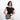 Woman holding a Sherpani Mei Sterling Houndstooth Anti-theft Travel Trio Crossbody by short strap against white backdrop.   #color_houndstooth-print