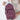 Woman pulling a notebook out of a Sherpani Metro Smoky Orchid Anti-theft Reversible Sling against white backdrop. 