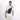 A man wearing a Sherpani Metro Sterling Anti-theft Reversible Sling on her front against a white background.  #color_carbon-black