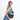Woman wearing a Sherpani Milli Chromatic Black Mini Messenger against white backdrop.  #color_chromatic-black