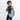 A woman holding a Sherpani Mina Surf Blue Medium Crossbody Bag in her hands with short-strap attachment. #color_surf-blue