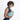 Woman wearing a Sherpani Mina Surf Blue Medium Crossbody Bag against white background.  #color_surf-blue