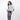 Woman wearing a Sherpani Prima  Houndstooth Travel Crossbody around her shoulder against white background. #color_houndstooth-print