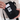 Person placing a card in back card pocket on Sherpani Rogue Chromatic Black Mini Crossbody.