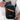 Person placing a passport inside Sherpani Rogue Chromatic Black Mini Crossbody.