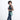 Woman wearing a Sherpani Rogue Surf Blue Mini Crossbody on her shoulder against white background.   #color_surf-blue