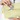 Person placing a key on keychain inside Sherpani Skye Sol Yellow Shoulder Bag.