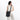 Woman wearing a Sherpani Vale Carbon Black Anti-theft Reversible Crossbody against white background. #color_carbon-black