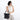 Woman wearing a Sherpani Vale Carbon Black Anti-theft Reversible Crossbody against white background. #color_carbon-black