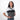 Woman wearing a Sherpani Vale Granite Anti-theft Reversible Crossbody against white background. #color_granite-grey