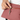 Person placing a key on keychain inside Sherpani Zoom Desert Pink Slim RFID Crossbody.