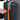Person pulling extender zipper of a Sherpani Meridian Black Carry-On Luggage. #color_chromatic-black