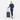 Woman holding a Sherpani Meridian Granite Carry-On Luggage by the handle against white backdrop. #color_granite-grey