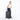 Woman holding a Sherpani Meridian Granite Checked-Luggage by the handle against white backdrop #color_granite-grey