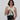A Woman shows features of a Sherpani Mei Carbon Black Anti-theft Travel Trio Crossbody, such as an RFID front pocket. 