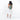 A woman wearing a Sherpani Esprit Aloe Mist Green Anti-theft Sling Bag on her back against a white background. #color_aloe-mist-green