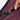 Person locking the zipper on a Sherpani Esprit Smoky Orchid Anti-theft Sling.