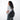 Woman wearing a Sherpani Esprit Carbon Black Anti-theft Sling on her back against white backdrop. #color_carbon-black