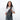 Woman wearing a Sherpani Esprit Granite Anti-theft Sling on her front against white backdrop.  #color_granite-grey