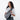 A woman wearing a Sherpani Esprit Houndstooth Anti-theft Sling Bag on her front against a white background. #color_houndstooth-print