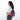 Woman wearing a Sherpani Esprit Smoky Orchid Anti-theft Sling on her back against white backdrop. #color_smoky-orchid-pink