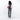 Woman wearing a Sherpani Esprit Smoky Orchid Anti-theft Sling on her back against white backdrop. #color_smoky-orchid-pink