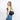 Woman wearing a Sherpani Esprit Palm Green Sling Bag against white background.  #color_palm-green