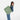 A woman wearing a Sherpani Jetsetter Olivine Travel Tote Bag on white backdrop. #color_olivine-green