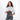 Woman holding a Sherpani Co-Pilot Granite Grey Travel Toiletry Case against white backdrop. #color_granite-grey